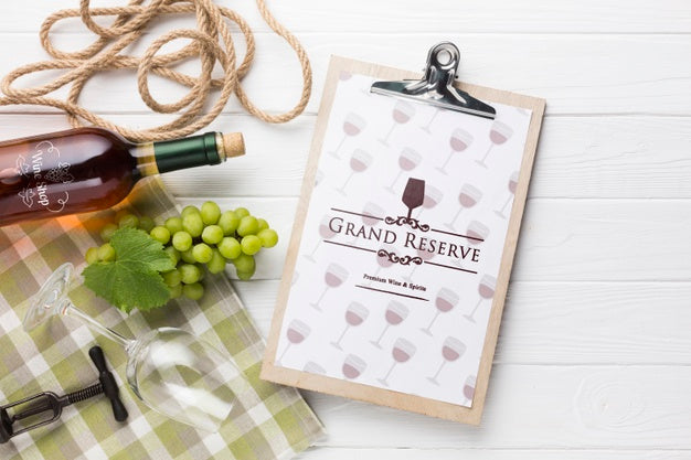 Clipboard With Bottle Of Wine Beside Psd