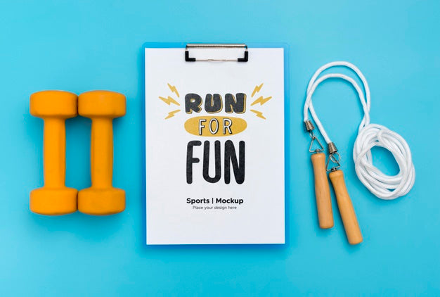Clipboard With Jumping Rope And Weights Beside Psd