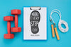 Clipboard With Weights Beside And Jumping Rope Psd