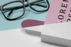 Close-Up Book Mock-Up With Glasses And Bookmark Psd