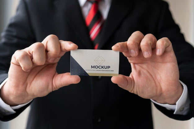 Close-Up Businessman Holding Business Card Mock-Up With Both Hands Psd