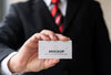 Close-Up Businessman Holding Business Card Mock-Up With One Hand Psd