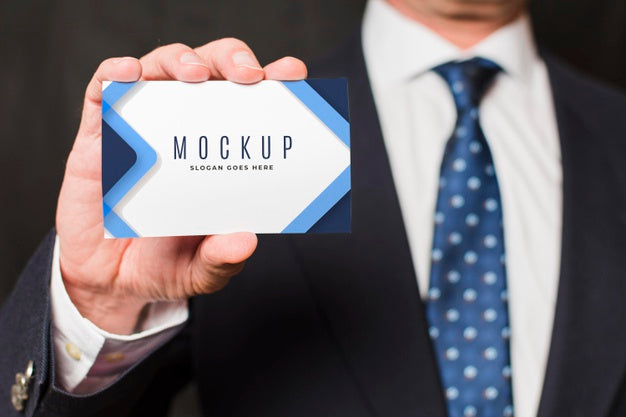 Close-Up Businessman Holding Business Card Psd
