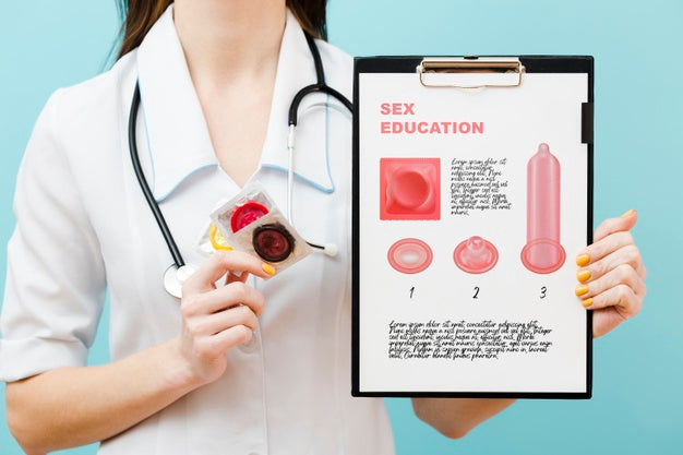 Close-Up Doctor Holding Condoms Psd