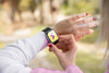 Close-Up Girl With Hoodie Looking At Smartwatch Psd