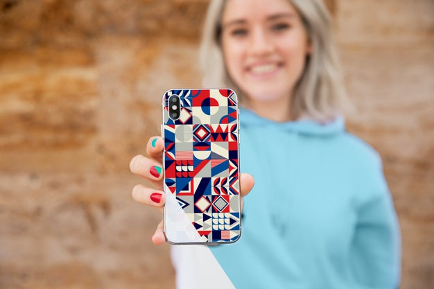 Close-Up Girl With Hoodie Showing Mobile Psd