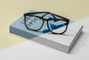 Close-Up Glasses On Book Mock-Up Psd