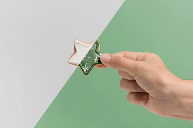 Close-Up Hand Holding Cookie Psd