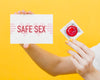 Close-Up Hand Holding Red Condom Psd