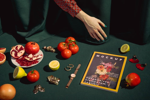 Close-Up Hand With Magazine And Tomatoes Psd