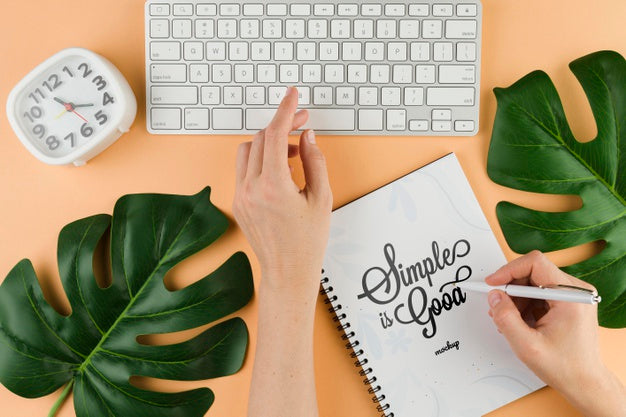 Close-Up Hand With Pen And Keyboard Psd