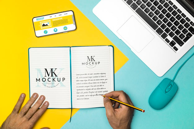 Close-Up Hand Writing On Notebook Psd