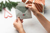Close-Up Hands Holding Envelope With Card Psd