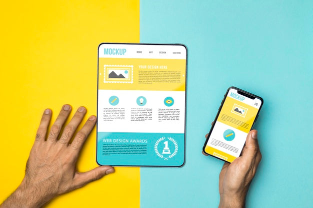 Close-Up Hands Holding Phone And Tablet Psd