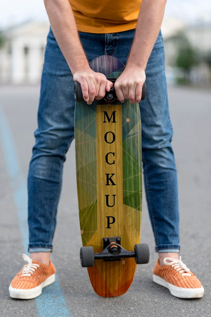 Close-Up Hands Holding Skateboard Psd