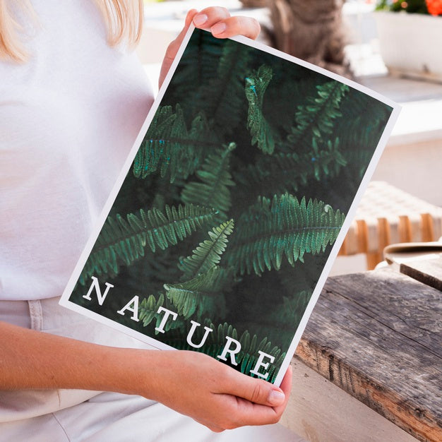 Close-Up Hands Showing A Nature Magazine Mock Up Psd