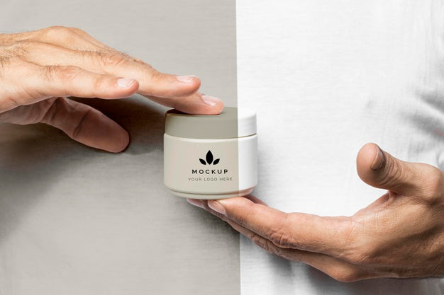 Close Up Hands With Cream Container Psd