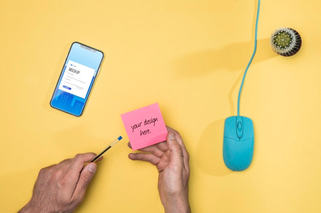 Close-Up Hands With Post-It And Pen Psd