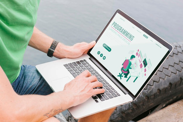 Close-Up Male Student Working On Laptop Psd