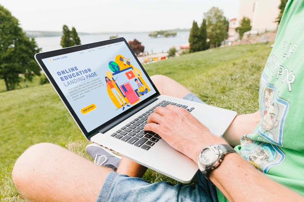 Close-Up Male Working On Laptop Outdoors Psd