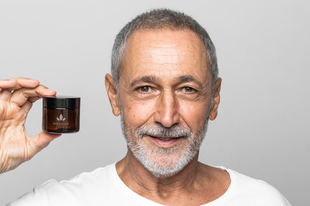 Close Up Man Holding Cream Container Psd