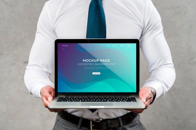 Close-Up Man Holding Laptop Psd