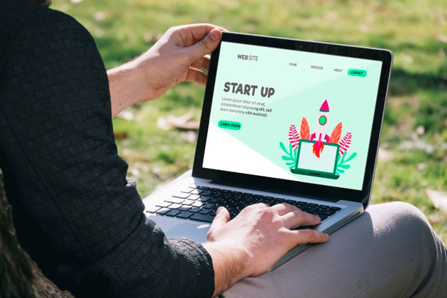 Close-Up Man Holding Laptop Psd