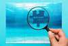 Close-Up Man Holding Magnifying Glass Psd