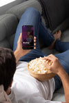 Close Up Man Holding Phone And Eating Popcorn Psd