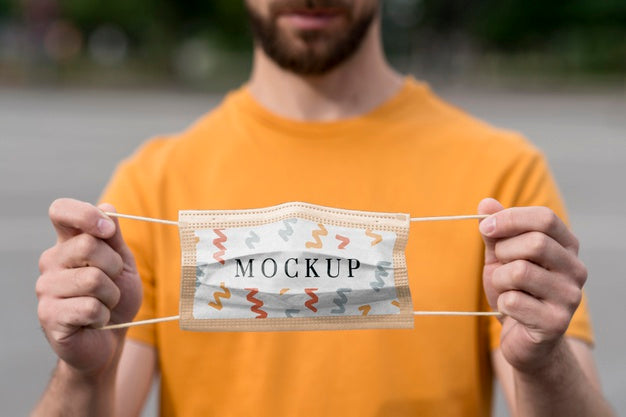 Close-Up Man Holding Protection Mask Psd