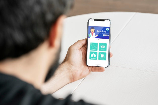 Close-Up Man Holding Smartphone Psd