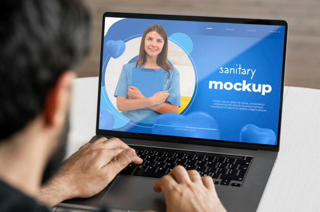 Close-Up Man Typing On Laptop Psd