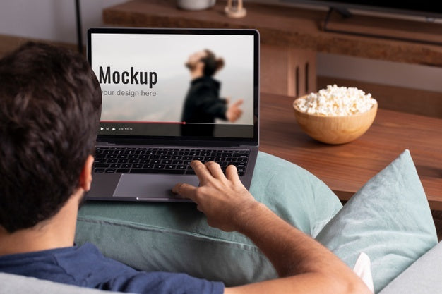 Close Up Man Watching Movie On Laptop Mockup Psd
