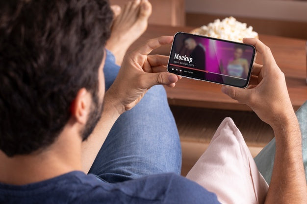 Close Up Man Watching Movie On Phone Psd