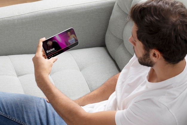 Close Up Man Watching Movie On Smartphone Psd