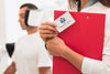 Close-Up Mock-Up Clinical Card And Man Doing Medical Exercises Psd