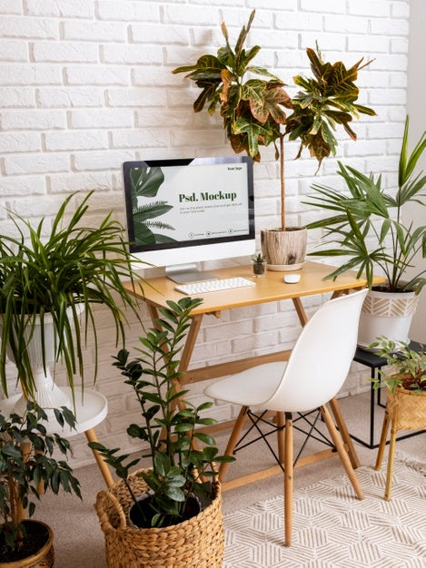 Close Up On Computer Mockup Surrounded By Plants Psd