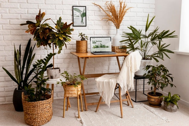 Close Up On Computer Mockup Surrounded By Plants Psd