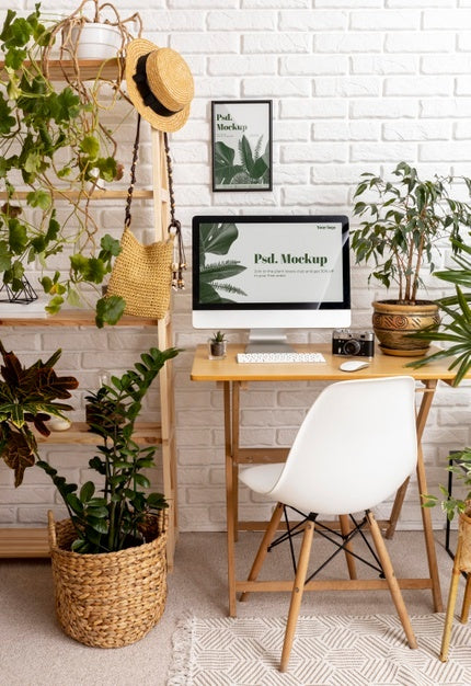 Close Up On Computer Mockup Surrounded By Plants Psd