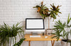 Close Up On Computer Mockup Surrounded By Plants Psd