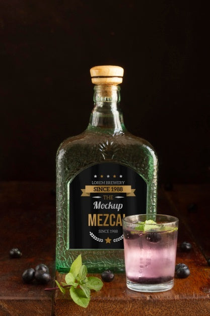 Close Up On Mezcal Drink Bottle With Ingredients Psd