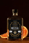Close Up On Mezcal Drink Bottle With Ingredients Psd