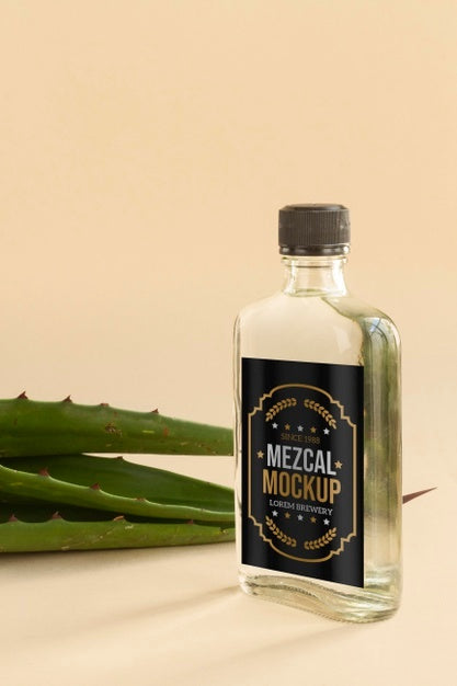 Close Up On Mezcal Drink Bottle With Ingredients Psd