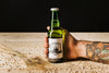 Close-Up Person Holding A Beer Bottle Psd