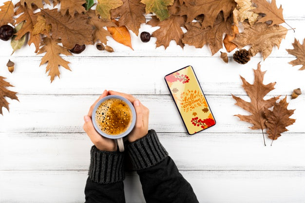 Close-Up Person With Coffee And Smartphone Psd