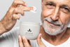 Close Up Senior Man Holding Cream Container Psd
