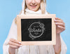 Close-Up Smiley Girl Holding Mock-Up Sign Psd