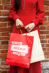 Close-Up Woman Holding Shopping Bags Outdoors Psd