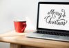 Closeup Of Computer Laptop With Merry Christmas Words Psd
