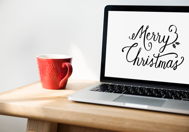 Closeup Of Computer Laptop With Merry Christmas Words Psd